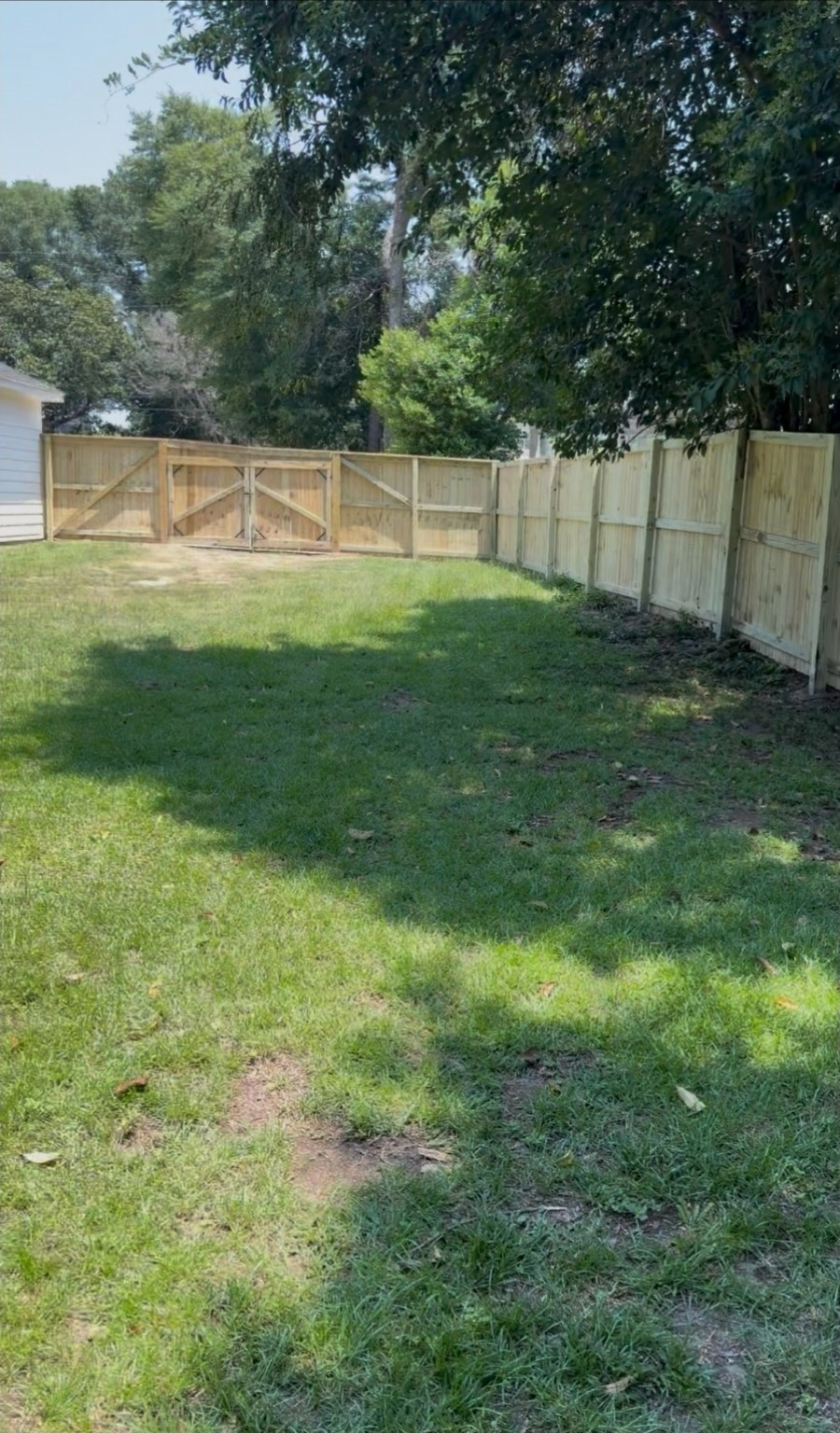 Wood privacy fence with double gate